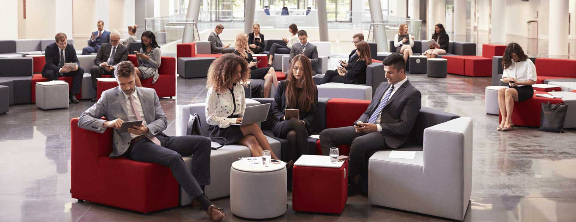 Business people sitting in a modern looking lobby
